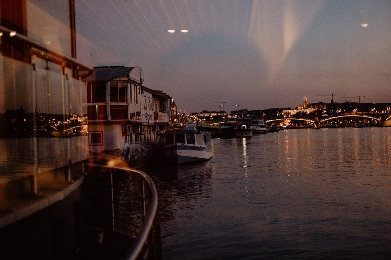 Dusk view from the boat across the Danube towards the bridge