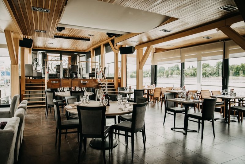 The ground-floor lounge with laid tables